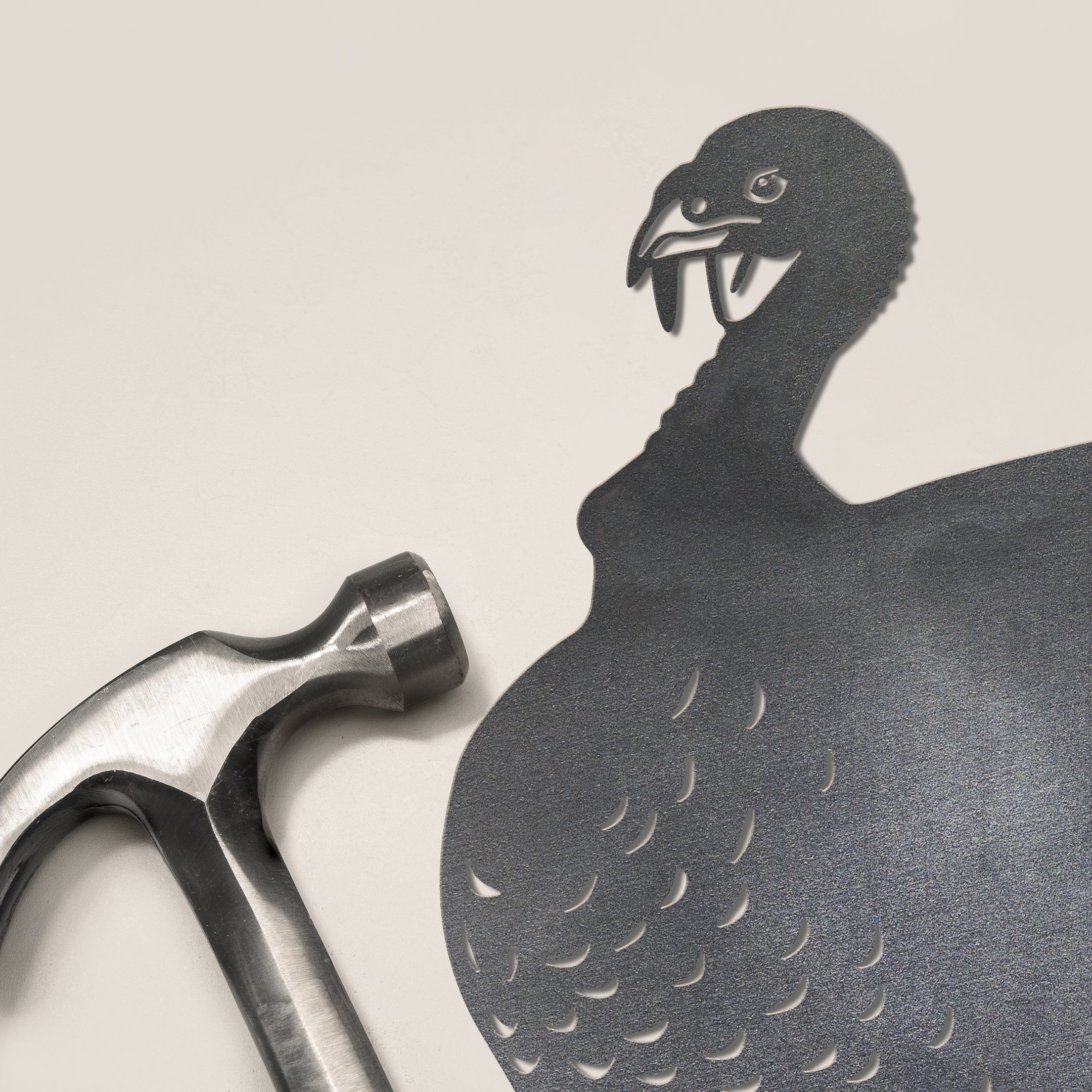 A corten steel product named "Turkey" casts a shadow shaped like a vulture with an open beak and visible fangs, adding an imaginative and unique visual effect to your yard.