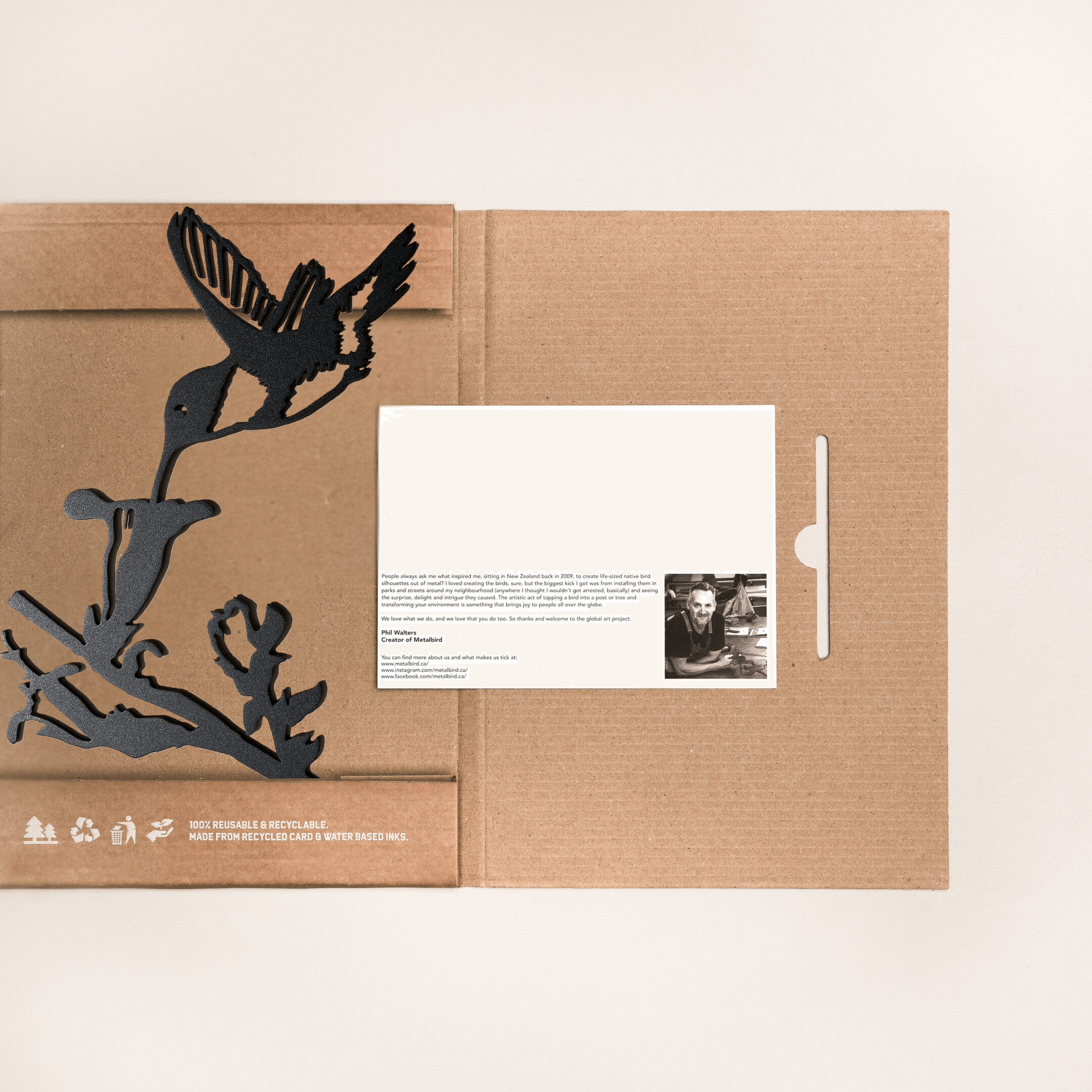 Hummingbird in gift box presentation black finish packaging and brand card visible.