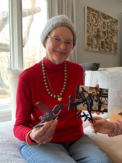Woman Holding the Metalbird Hummingbird