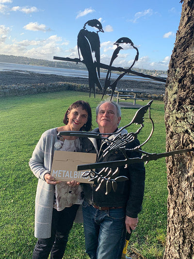 A Couple Enjoying the Metalbird Installed in the Tree
