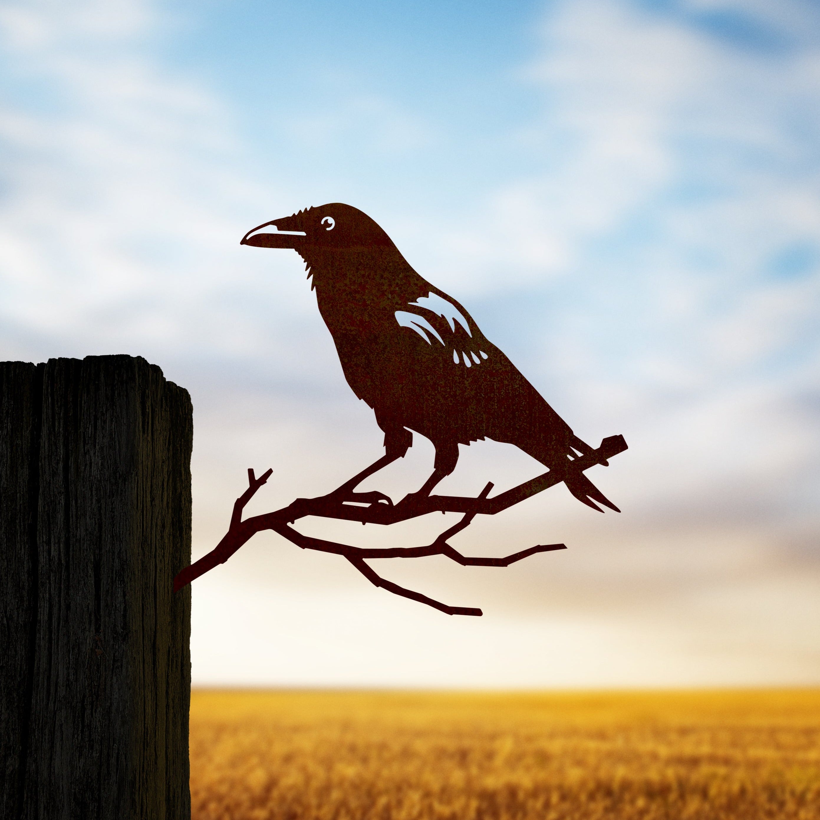 Crow silhouette in Corten steel placed in farmland scene for nature?inspired garden art.