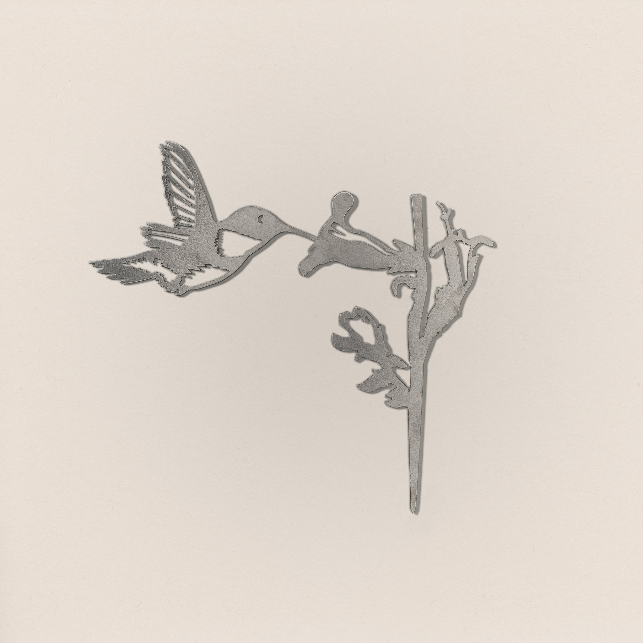 Hummingbird silhouette in raw Corten steel, ready for installation as outdoor bird sculpture and nature-inspired garden art.