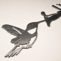 The Hummingbird Mom & Mini Set features Corten steel hummingbirds and flowers on a light background—an ideal hummingbird garden gift.