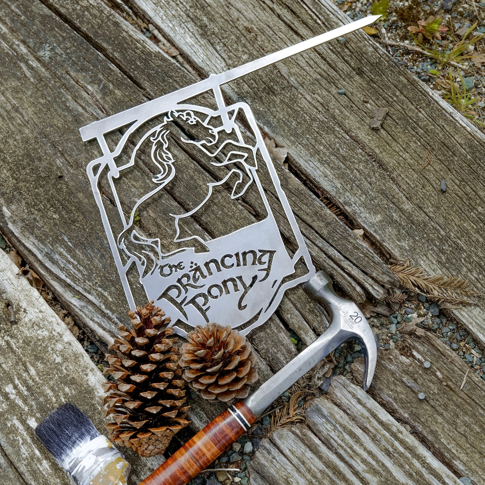 Packaging and presentation for The Prancing Pony with gift box and branding.