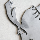 Close-up of Metalbird Seconds - Canada Jay, a gray metal wall art piece shaped like a Canada Jay, mounted on a textured white wall; part of the Seconds collection and may have subtle cosmetic imperfections.