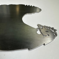 The Rhode Island Red is a flat metal sheet cut into the silhouette of a Rhode Island Red hen, featuring smooth edges and detailed face, comb, and beak that highlight its iconic shape. It lies on a smooth white surface.