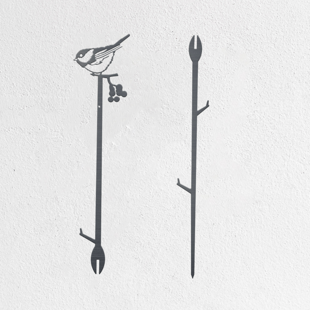 Minimalist wall art featuring two black branches: the left branch has a Chickadee, inspired by the Metalbird Seconds - Chickadee Plant Stake, perched on top with berries below; the right branch is bare, set against a plain white background.