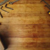 Cardinal bird silhouette in Corten steel being unboxed with info card on a workbench, ideal gift for bird lovers and DIY decorators.