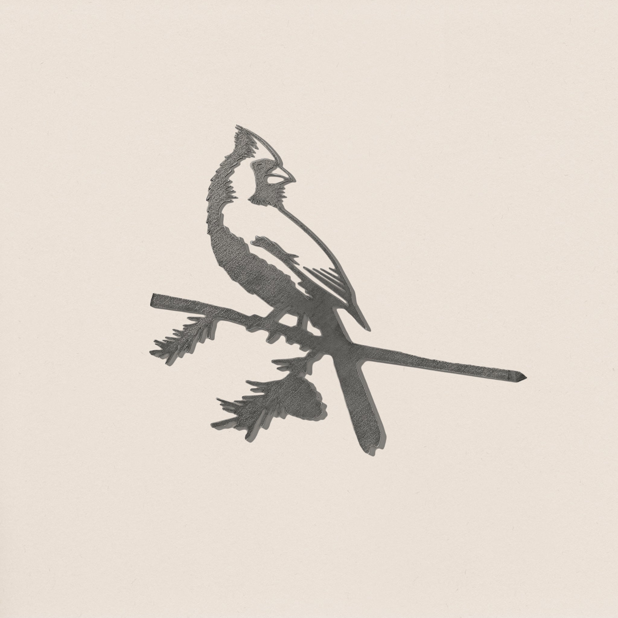 Cardinal silhouette crafted in raw Corten steel, designed for easy tree installation as meaningful garden art or memorial gift.