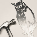 Raw Corten steel Great Horned Owl sculpture next to a hammer, ready for easy installation as striking garden art or memorial decor