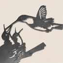 The "Hummingbird & Chicks" decor is a corten steel silhouette of a hummingbird feeding two chicks in a nest against a light background—perfect as a Mother's Day gift.