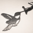 Close-up of Hummingbird silhouette in raw Corten steel. Precision-cut garden art. Stunning gift for nature and bird lovers



