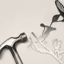 Corten steel hummingbird sculpture shown with a hammer, highlighting easy installation for outdoor garden art lovers in the USA.